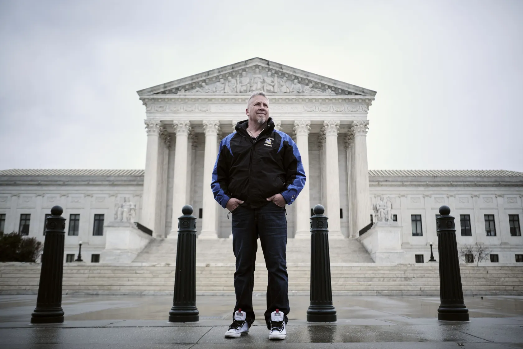 Joe Kennedy, a former assistant high school football coach in Bremerton, Washington, stands outside of the Supreme Court in Washington, D.C., on April 5, 2022. The court has agreed to hear a case he brought against the Bremerton School District that put him on leave after he refused to cease his practice of kneeling on the field for a post-game prayer.

T.J. Kirkpatrick, for the Deseret News