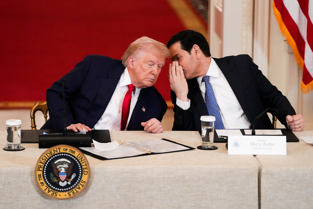 President Donald Trump speaks with Secretary of State Marco Rubio.