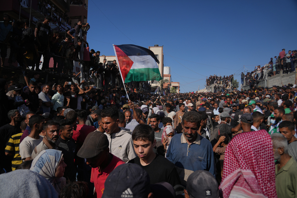 People gather to greet freed Palestinian prisoners as they arrive in the Gaza Strip after their release from Israeli jails under a ceasefire agreement between Hamas and Israel.