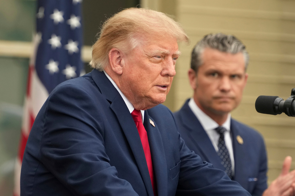 President Donald Trump speaks as Secretary of Defense Pete Hegseth listens during an observance ceremony on the 25th anniversary of the 9/11 attacks, Friday, Sept. 11, 2026, at the Pentagon in Washington.