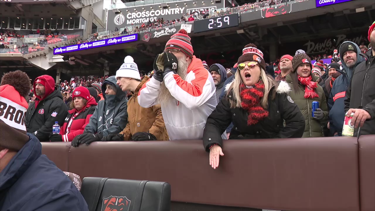 Longtime Browns season ticket holder Rich Stark, center, cheers for the team during a home game against the 49ers at Huntington Bank Field on Nov. 30, 2025.