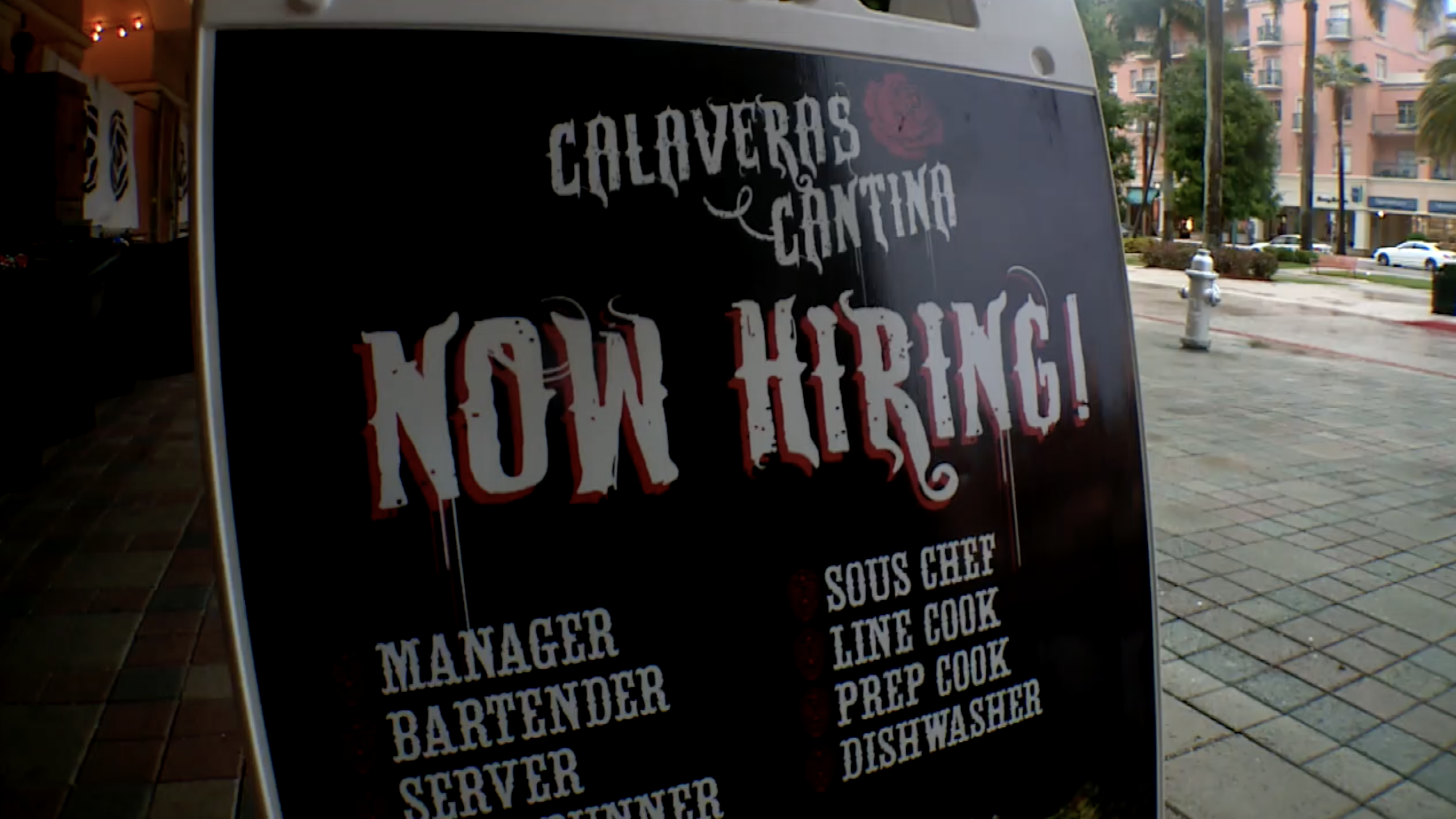 'Calaveras Cantina Now Hiring!' sign