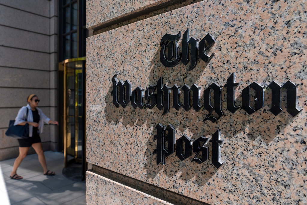 A person walks into the One Franklin Square Building, home of The Washington Post newspaper, June 21, 2024, in Washington. 