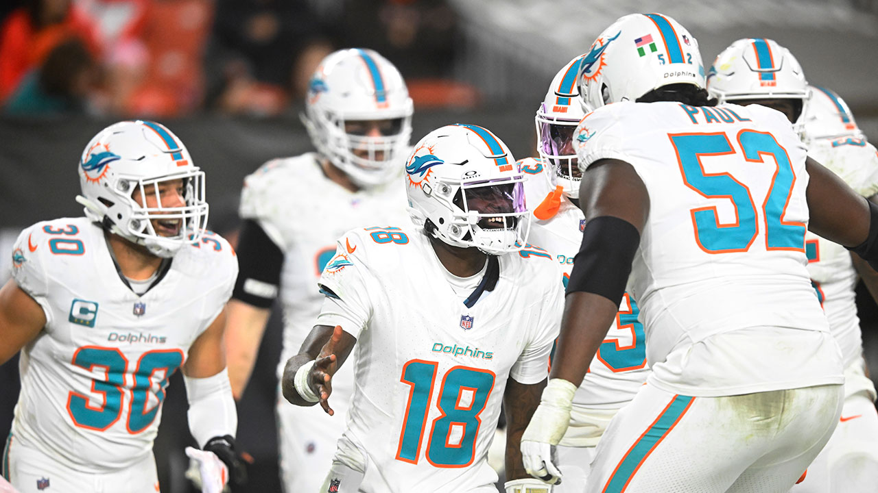 Miami Dolphins quarterback Tyler Huntley (18) celebrates after scoring a touchdown during the second half of an NFL football game against the Cleveland Browns Sunday, Dec. 29, 2024, in Cleveland.