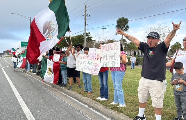 Residents gather to protest recent ICE raids