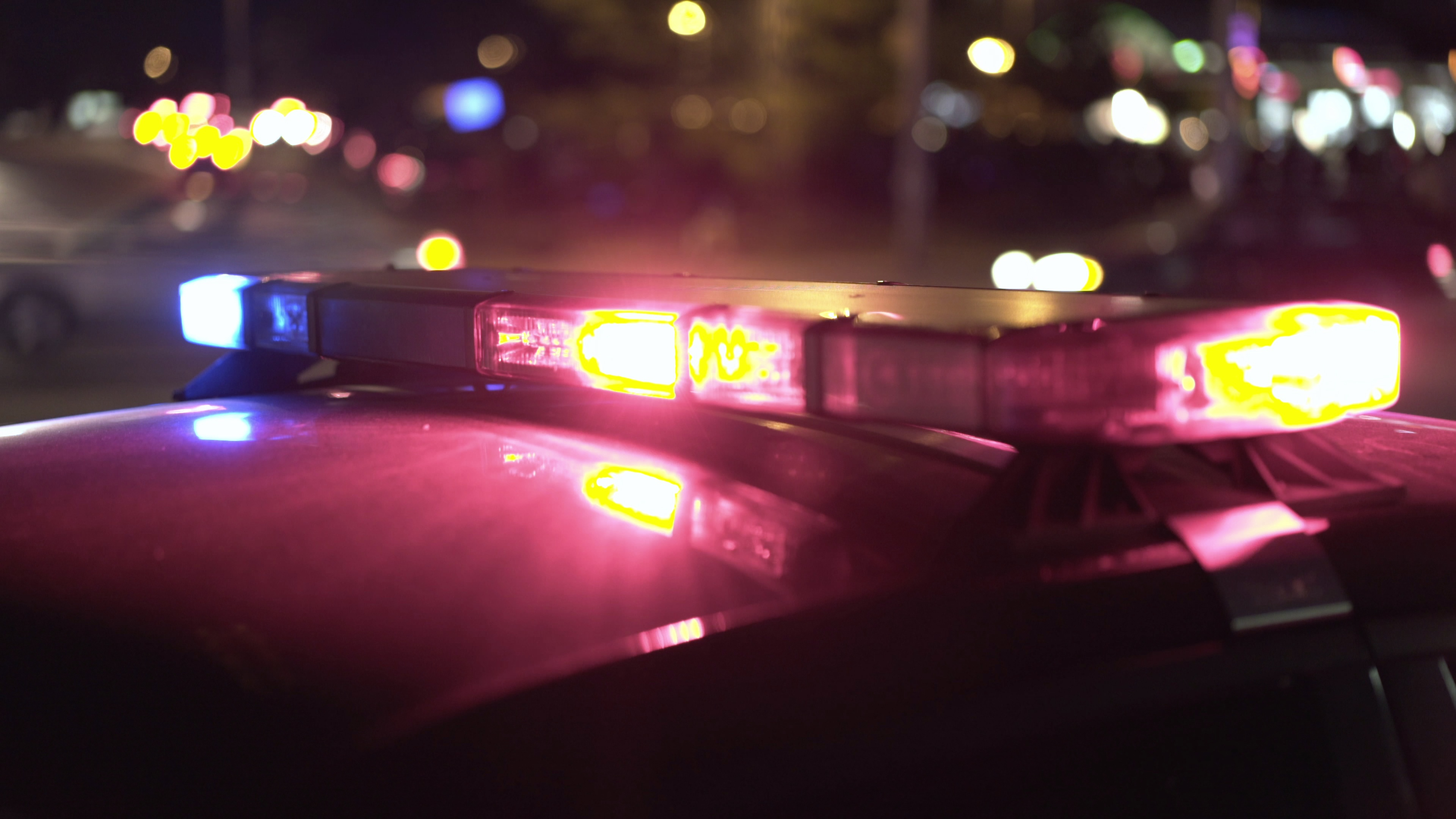 police-lights-flashing-at-accident-scene-during-night-time-4k-SBI-351566918.jpg