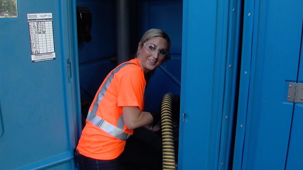 meredith in porta potty.PNG