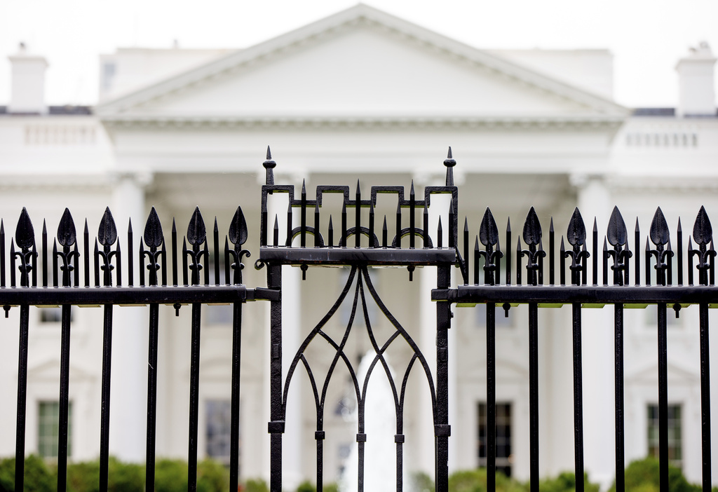 The White House is visible through the fence at the North Lawn in Washington, on June 16, 2016. 