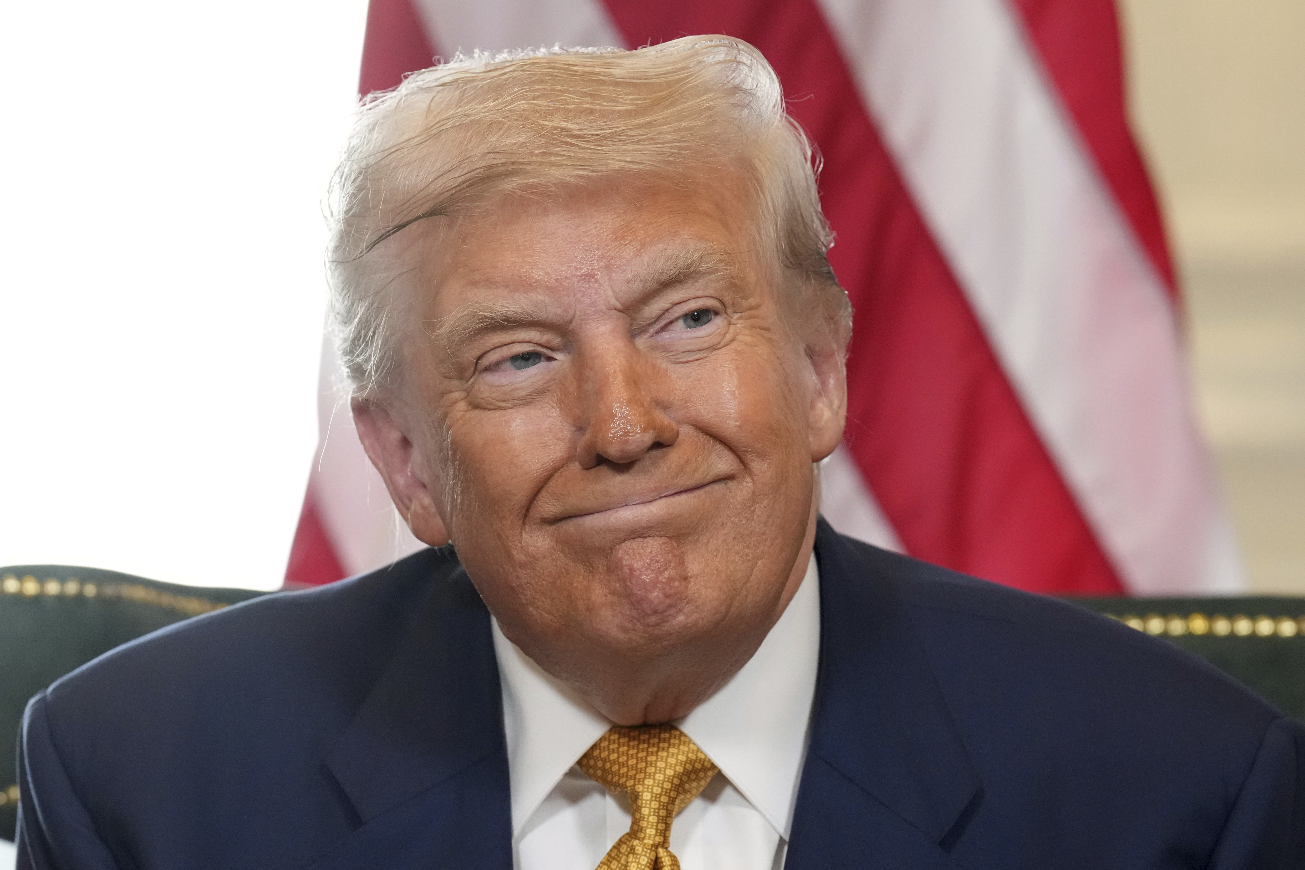 President Donald Trump reacts after reaching a trade deal with European Commission President Ursula von der Leyen at the Trump Turnberry golf course in Turnberry, Scotland Sunday, July 27, 2025. 