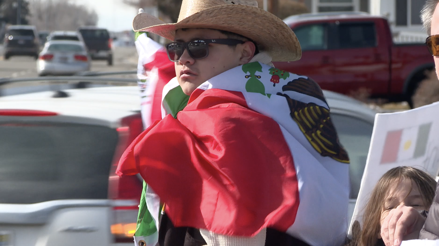 A man in a cowboy hat wears a Mexican flag like a cape during a demonstration showing support for immigrant communities on Saturday, Feb. 15, 2025 in Twin Falls