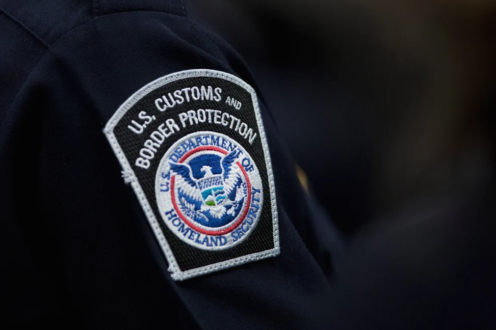A customs agent wears a patch for the U.S. Customs and Border Protection agency, Oct. 27, 2017, at John F. Kennedy International Airport in New York.