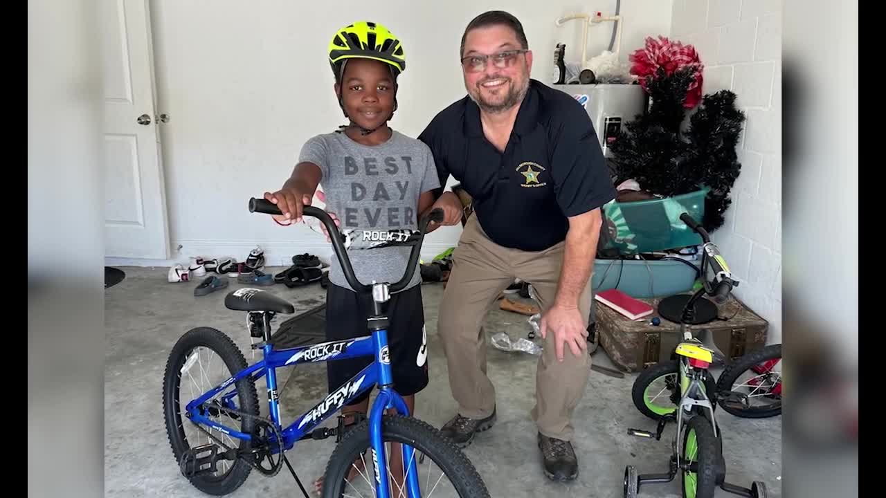 Deputy helps autistic child with bike