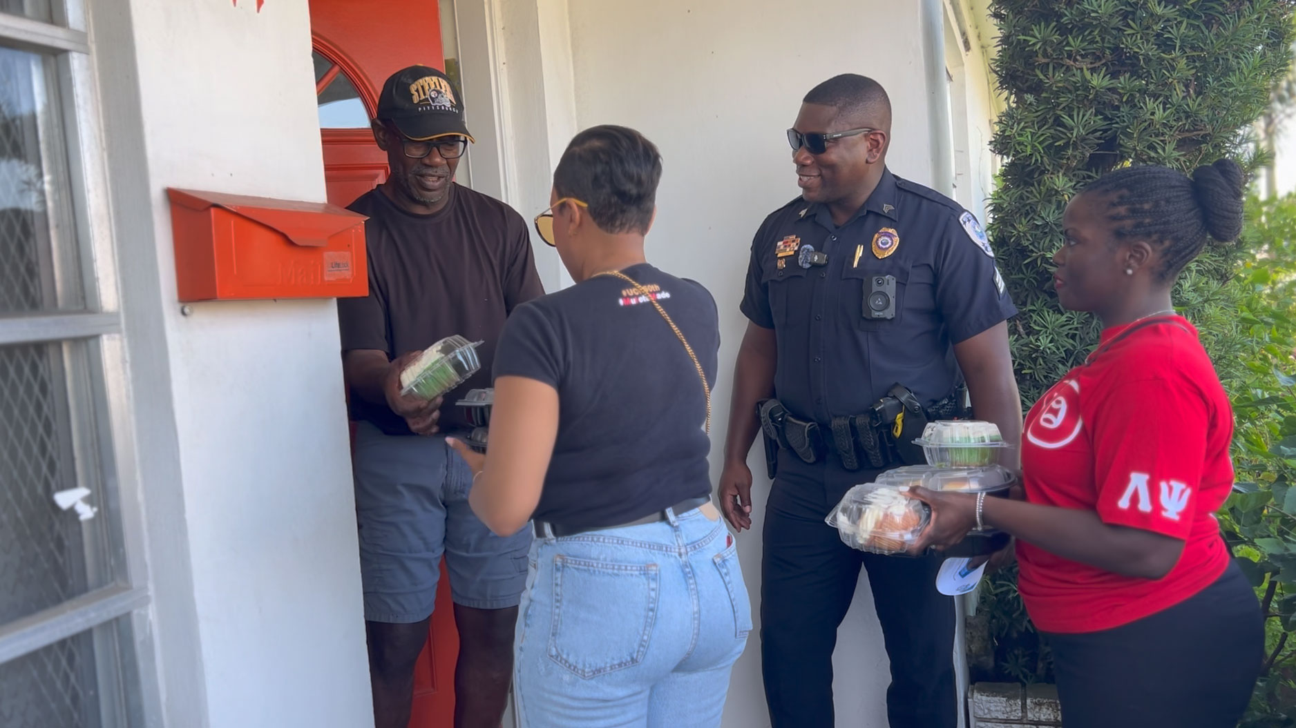 West Palm Beach police officers went door to door handing out hot Thanksgiving meals to families in need on Nov. 23, 2023.