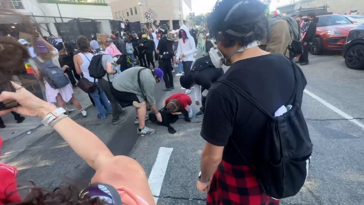 Tucker Collins on the ground during a demonstration in Los Angeles. 