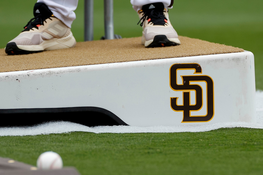 Detailed view of a San Diego Padres logo on a pitching mound during batting practice prior to a baseball game between the Padres and Boston Red Sox, May 20, 2023, in San Diego.