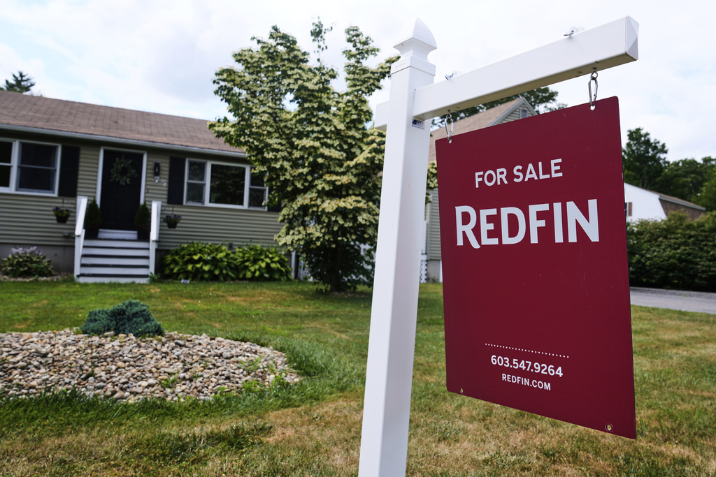 A for sale sign, from the Redfin brokerage, is displayed in front of a single family home, Thursday, July 17, 2025, in Derry, N.H. 
