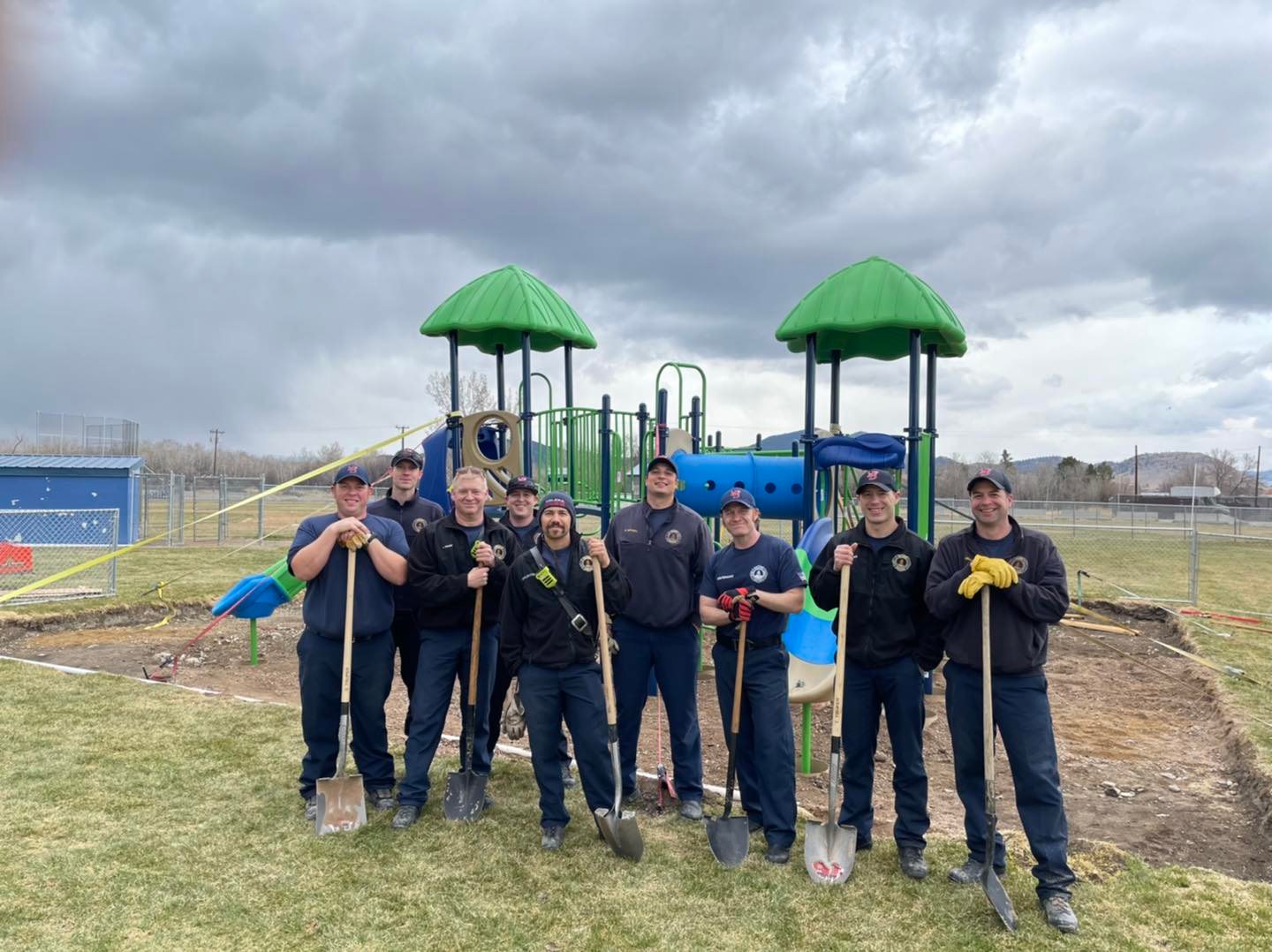 Helena firefighters help build playground