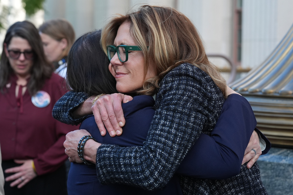 Laura Marquez-Garrett, attorney for SMVLC (Social Media Victims Law Center), embraces Julianna Arnold, right, parent, outside Los Angeles Superior Court on Thursday, March 12, 2026.