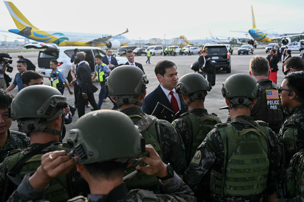 Secretary of State Marco Rubio meets members of the armed forces before departing from Ninoy Aquino International Airport in Manila, Philippines, following his visit to attend the Association of Southeast Asian Nations (ASEAN) Foreign Ministers Meetin.