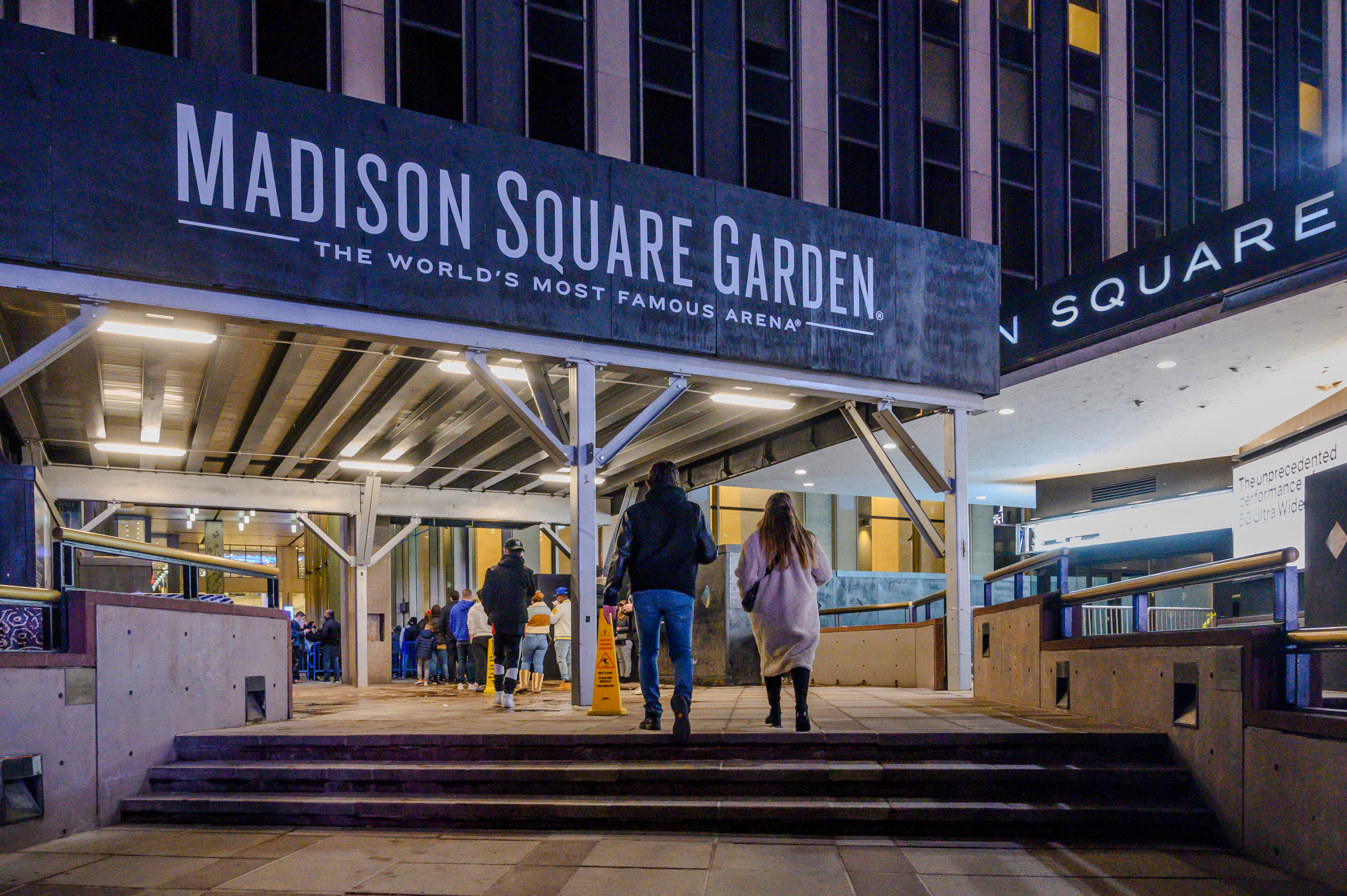 Fans line up outside Madison Square Garden before an NBA basketball game.