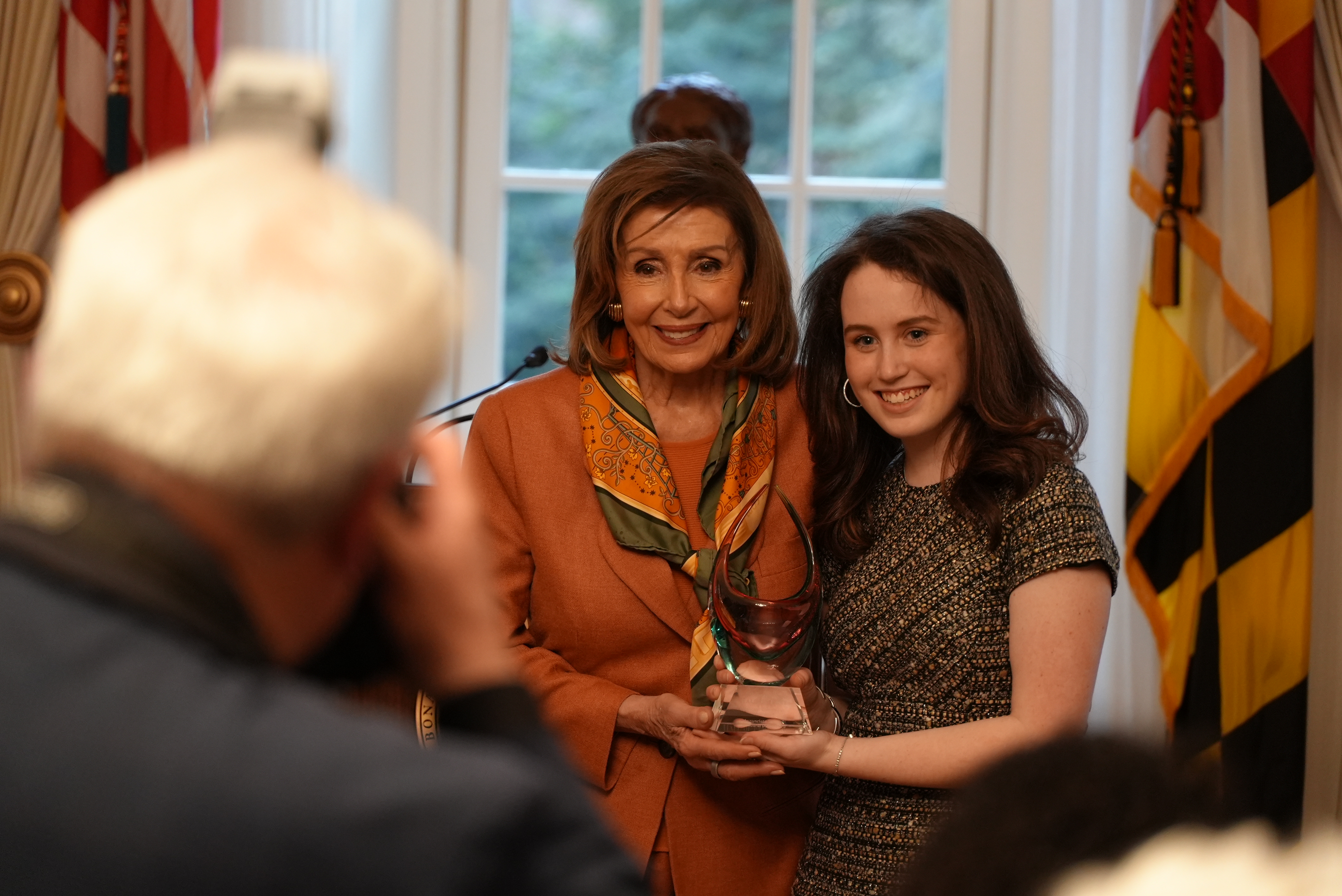 Nancy Pelosi with her mother's Hall of Fame award