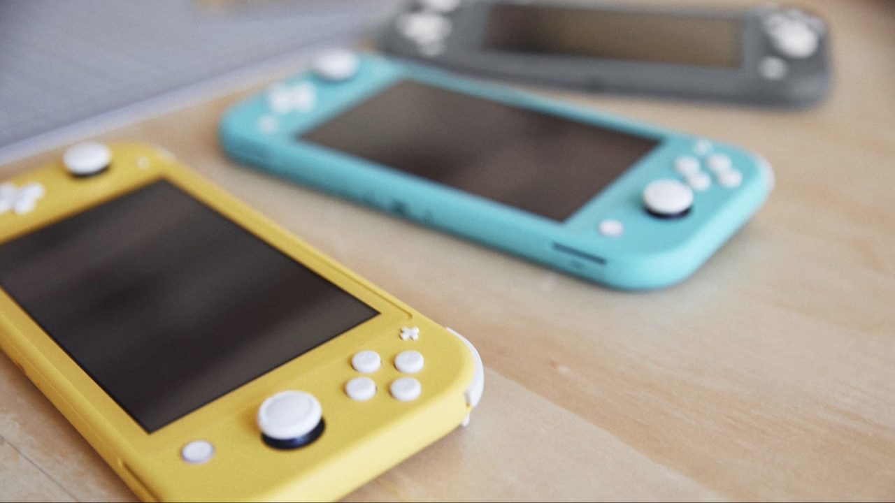Nintendo switches lie on a table.