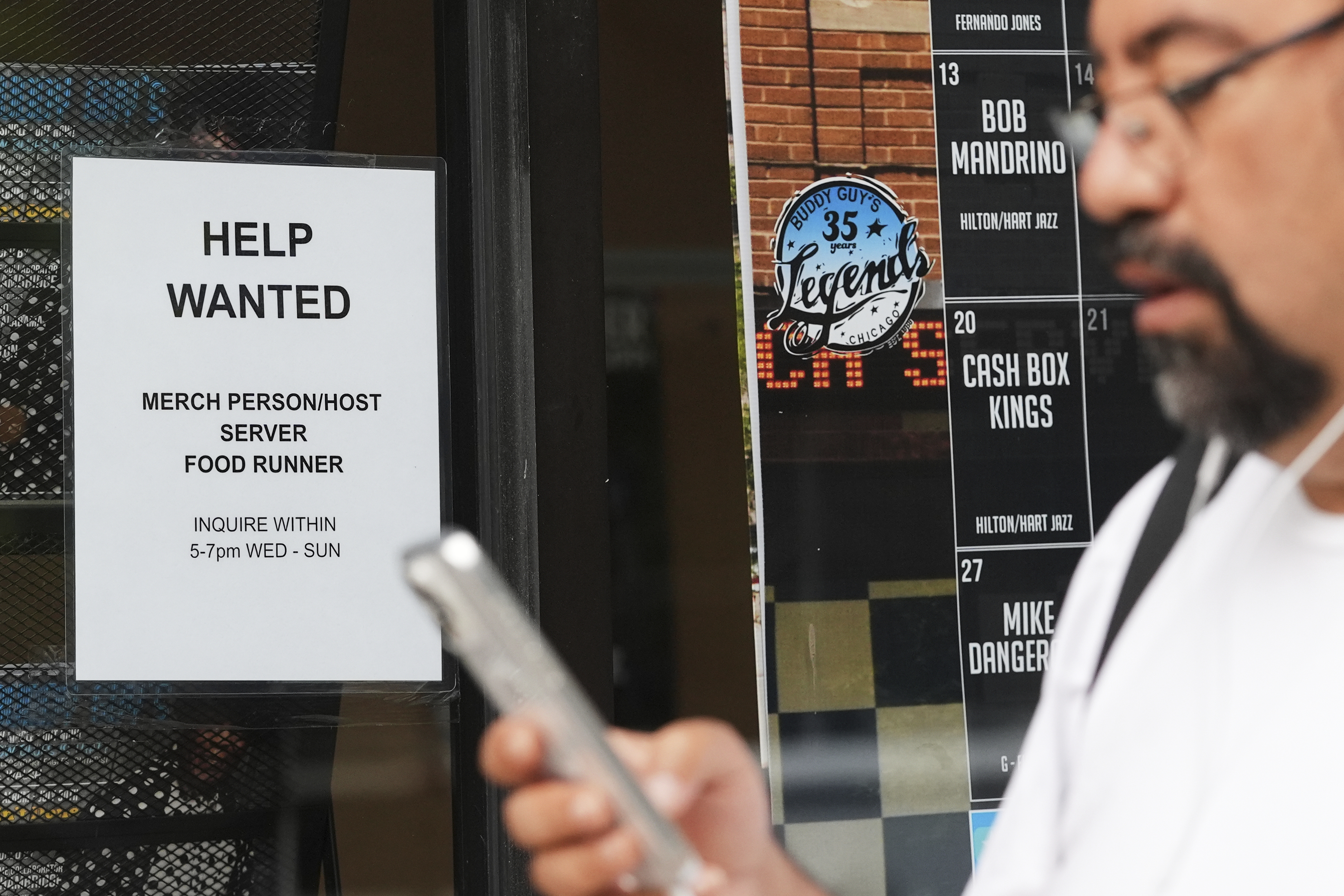 Help wanted sign is displayed at a live music and blues club in Chicago, Thursday, July 24, 2025. 