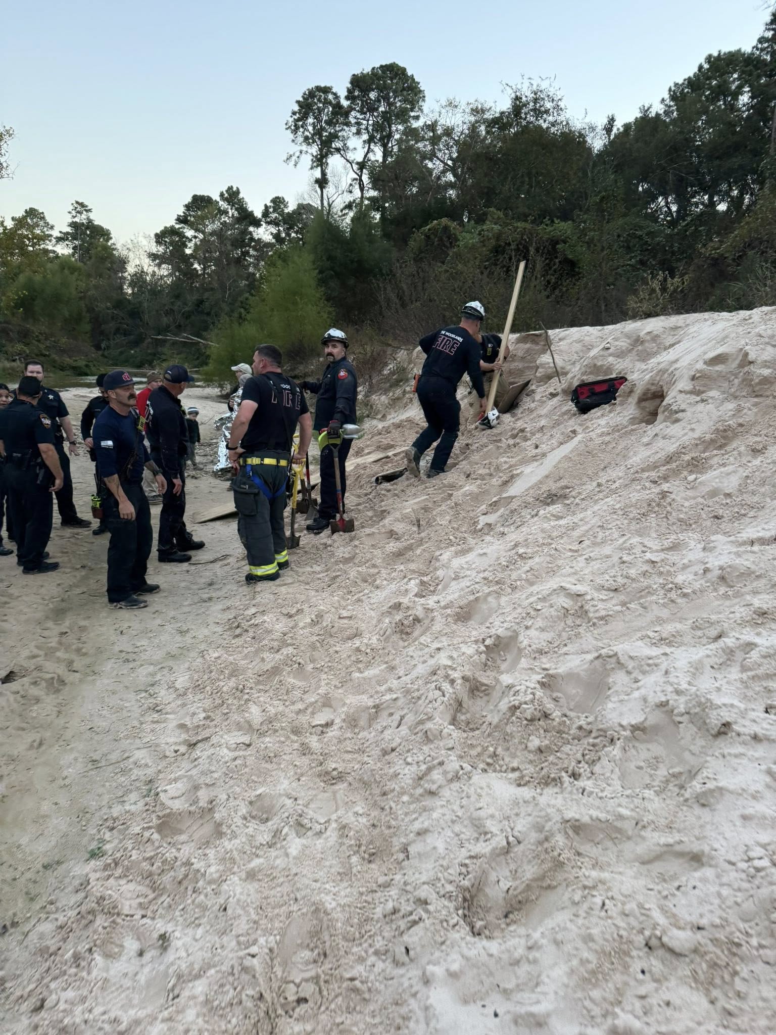 Firefighters rescue girl from sand collapse