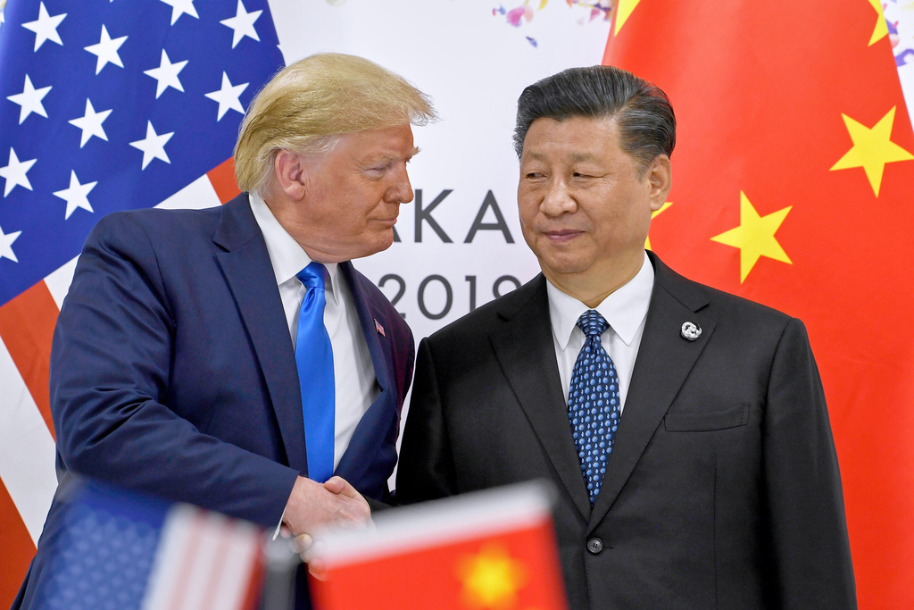 U.S. President Donald Trump, left, shakes hands with Chinese President Xi Jinping during a meeting on the sidelines of the G-20 summit in Osaka, western Japan,  June 29, 2019.