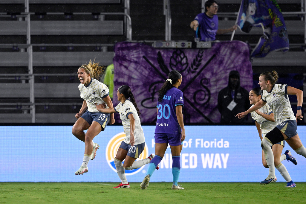 Seattle Reign FC forward Brittany Ratcliffe (13) celebrates after scoring a goal during an NWSL soccer match against the Orlando Pride, Sunday, March 15, 2026 in Orlando, Fla. 