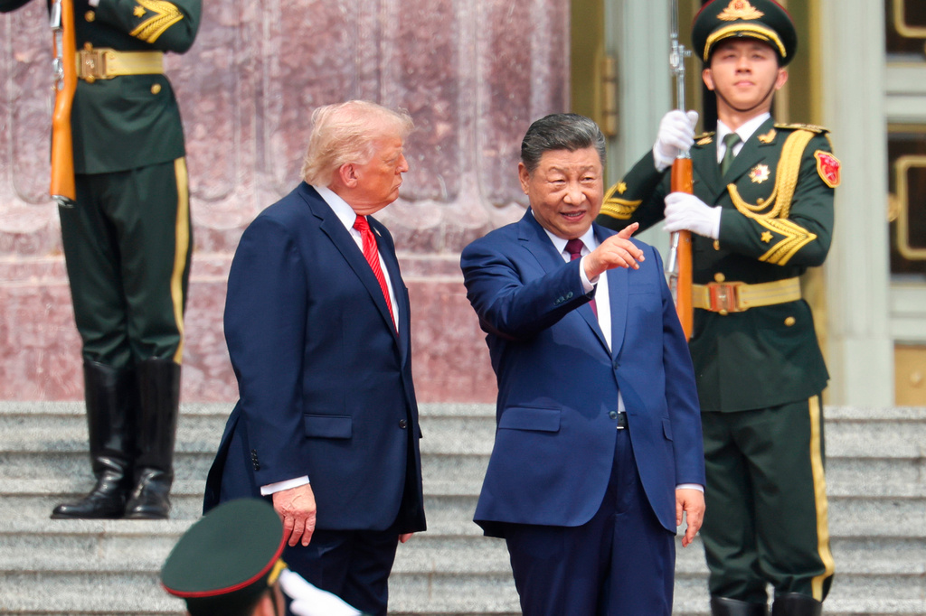 Chinese President Xi Jinping, center, attends a welcome ceremony with U.S. President Donald Trump, left, at the Great Hall of the People in Beijing, Thursday, May 14, 2026. 
