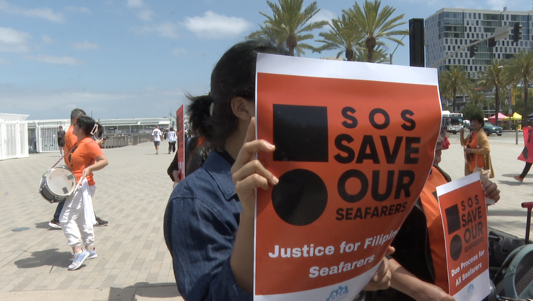 Protestors march around Harbor Drive on Saturday morning.