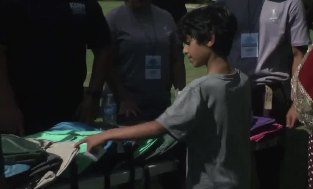 Child at Ready Set Back 2 School Health and Wellness Fair backpack giveaway