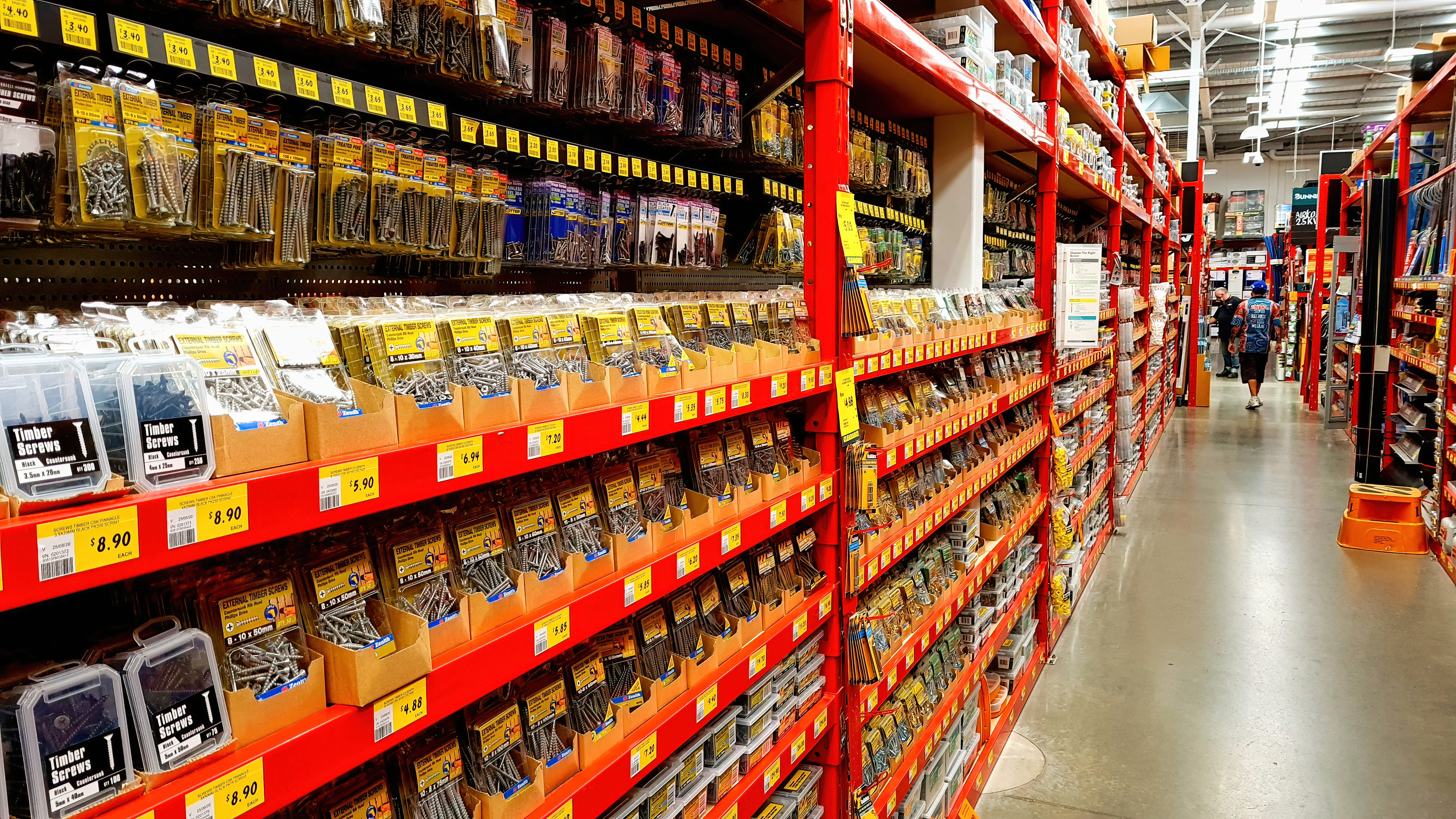 An isle of screws and other fasteners in hardware store