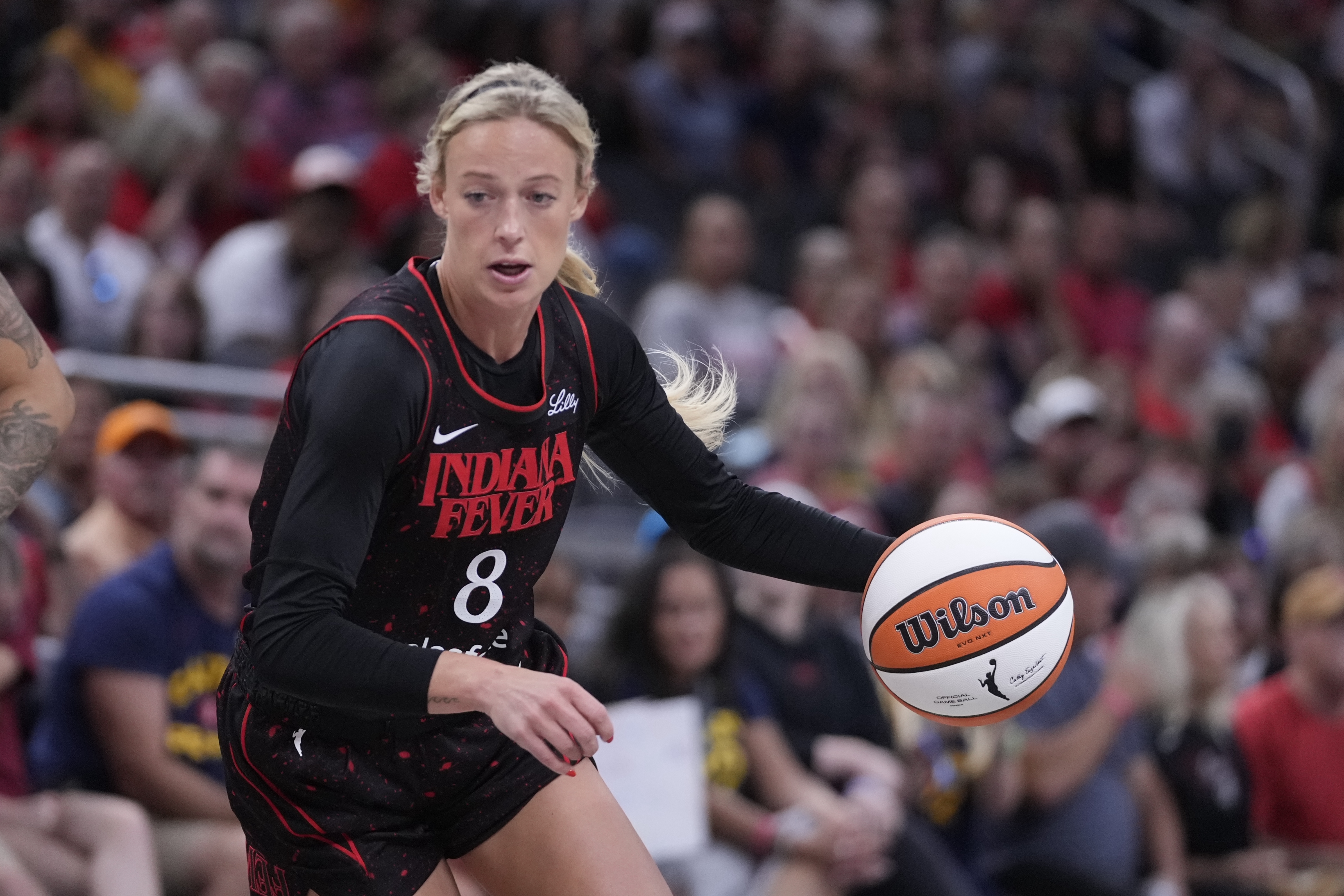 Indiana Fever's Sophie Cunningham dribbles during the first half of a WNBA basketball game against the Las Vegas Aces, Thursday, July 24, 2025, in Indianapolis. 