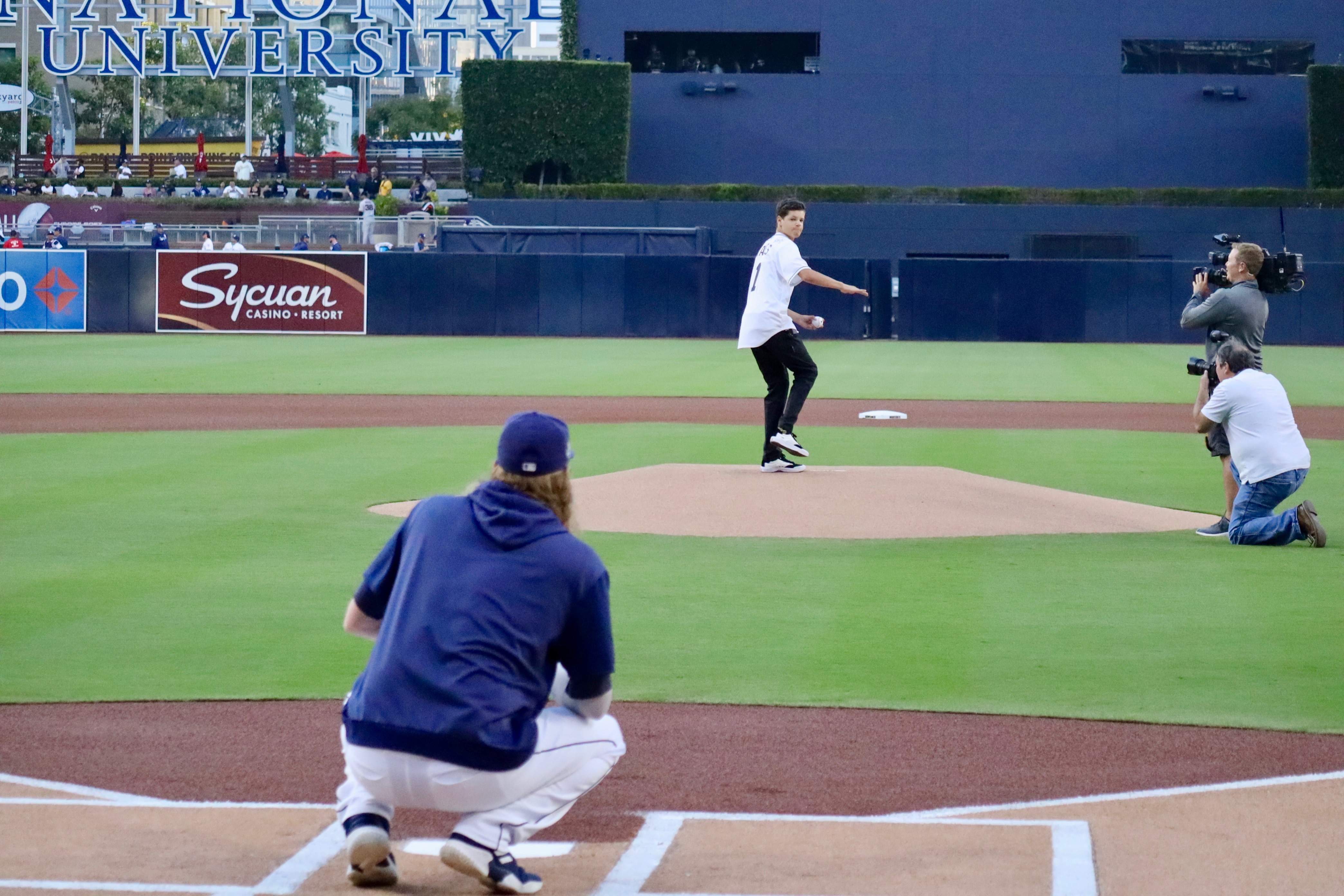 Teen bitten by shark throws first pitch at Padres game