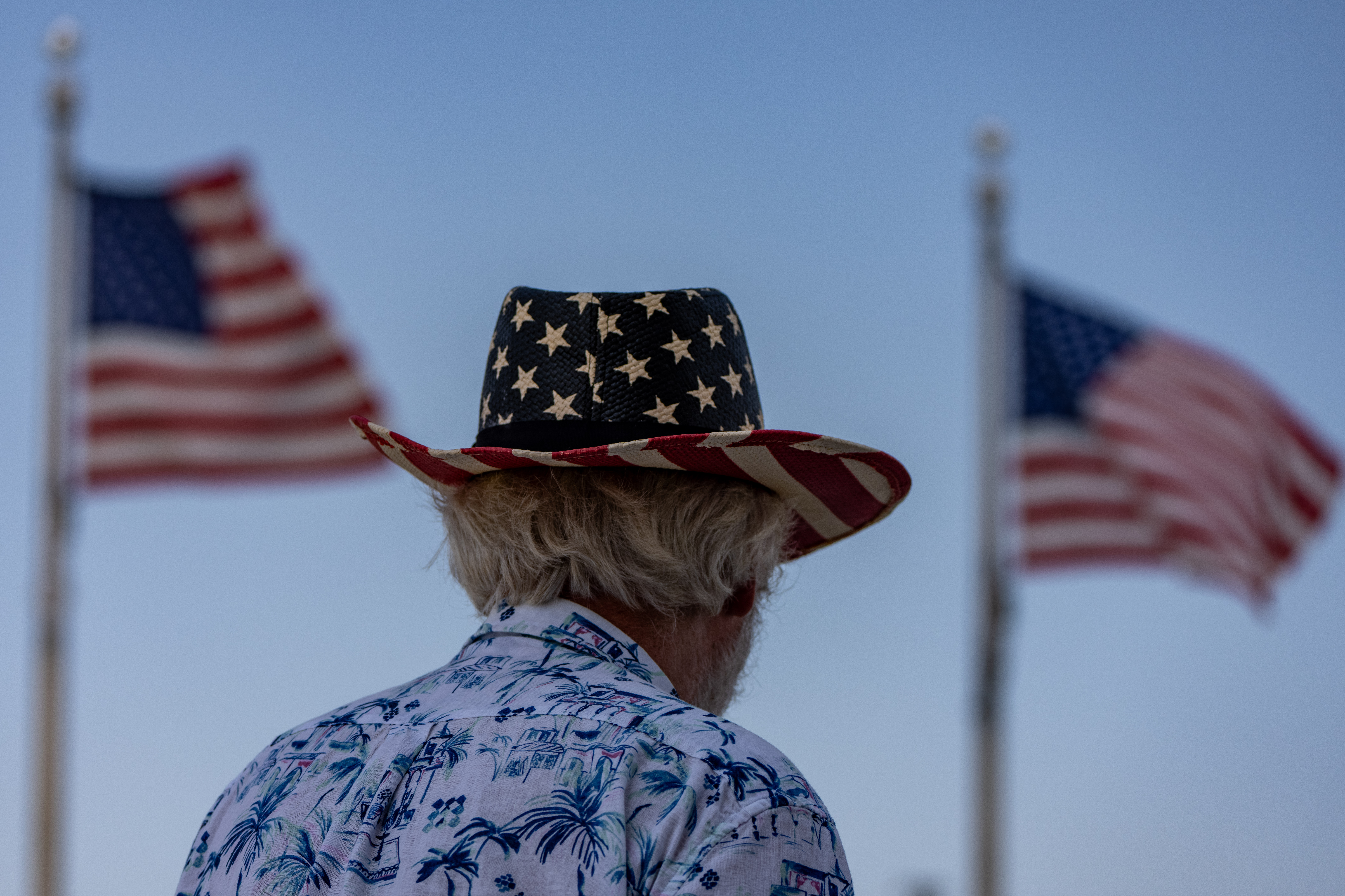 A man walks near the Washington Monument on the National Mall, Thursday, July 2, 2026, in Washington.