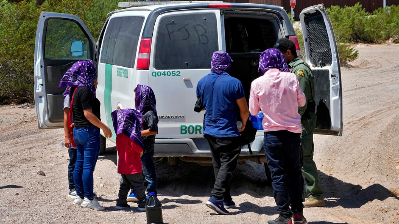 A group picked up by a Customs and Border Patrol agent after they crossed the border fence.