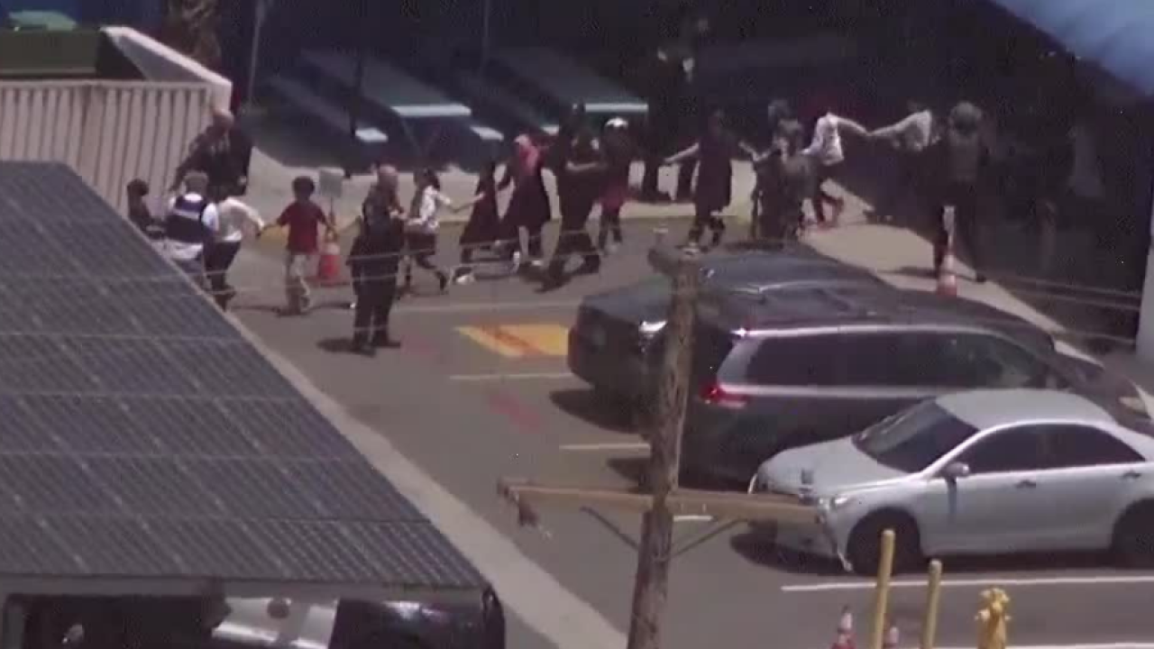 Children seen walking out following reports of an active shooter situation at the Islamic Center of San Diego in Clairemont Mesa.