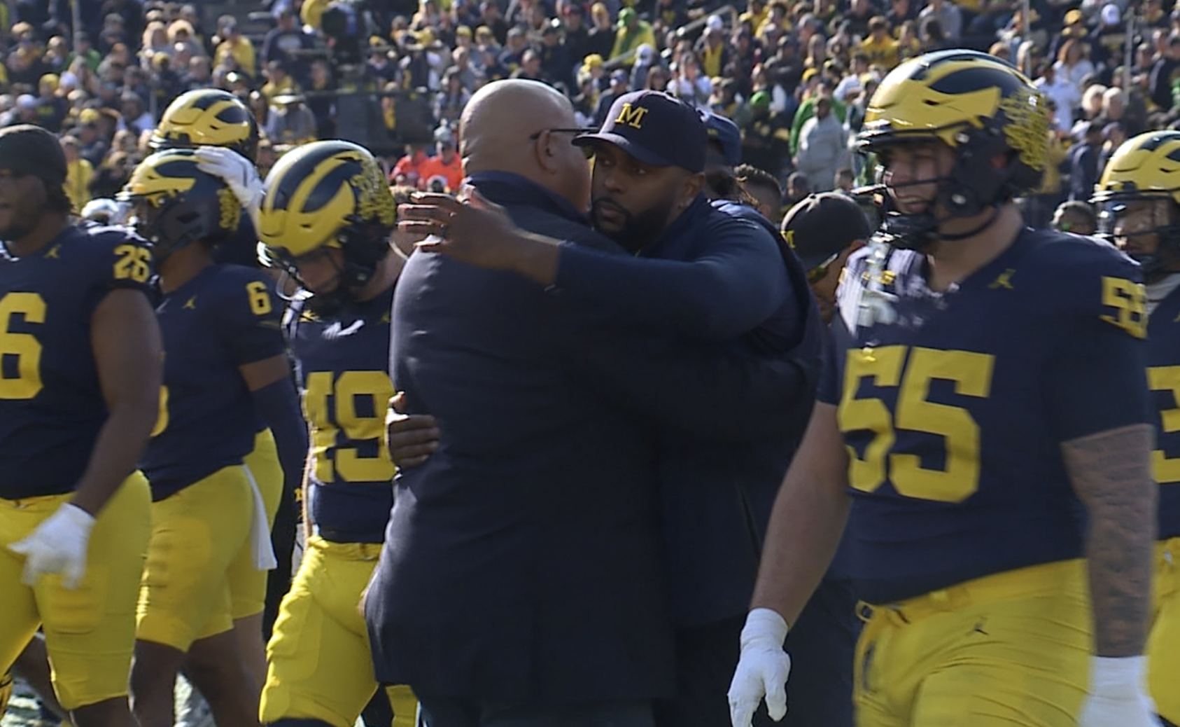 Sherrone Moore Warde Manuel hug