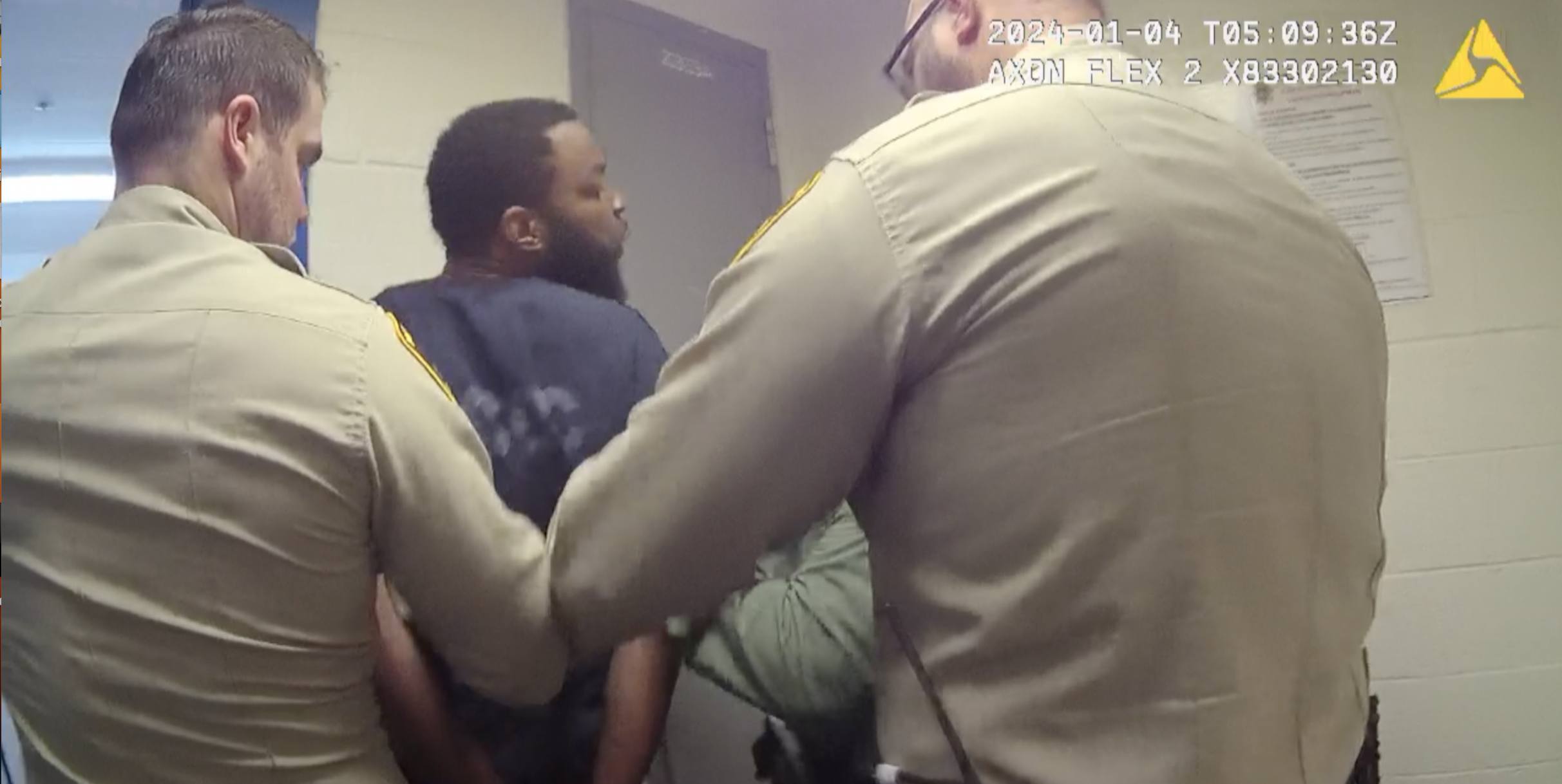 NEW VIDEO SHOWS SUSPECT SPITTING ON CORRECTIONS OFFICER 