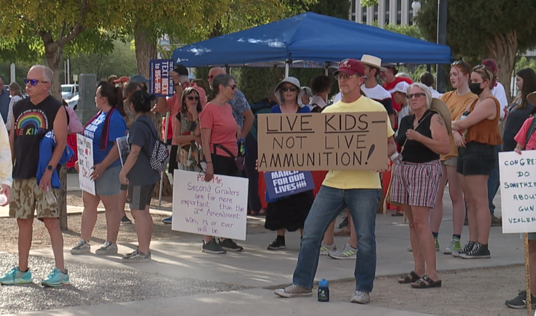 People in Tucson's Armory Park protest government inaction on gun reform.