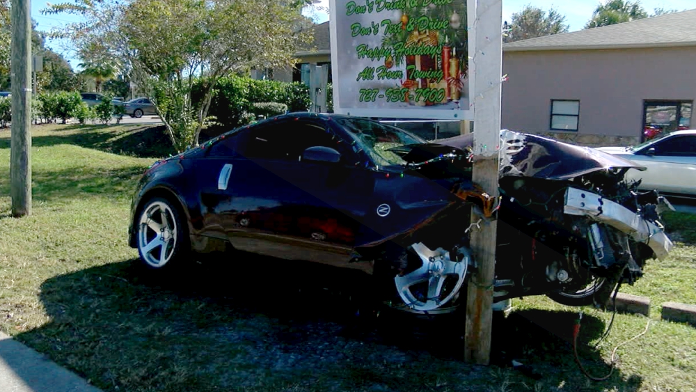 crashed car decorated for Christmas