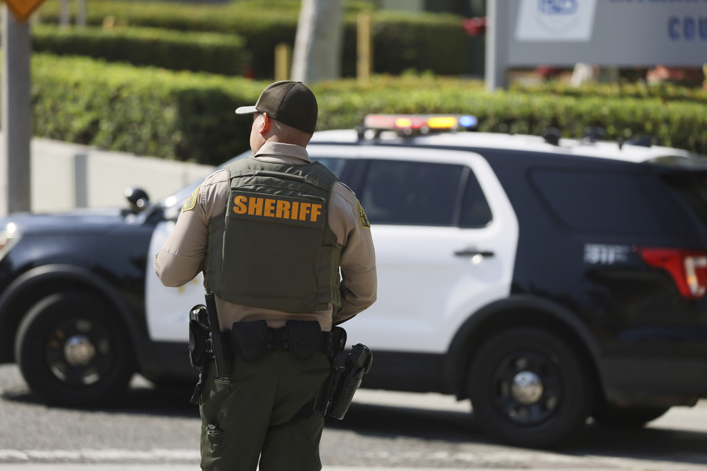A sheriffs deputy monitors a street closure near the site of an explosion at the LA County Sheriff's Special Operations Bureau on Friday, July 18, 2025, in Los Angeles.