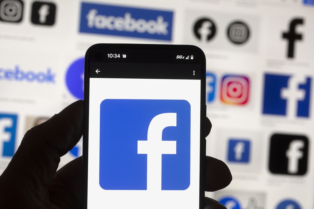 The Facebook logo is seen on a cell phone in Boston, USA, Oct. 14, 2022. 