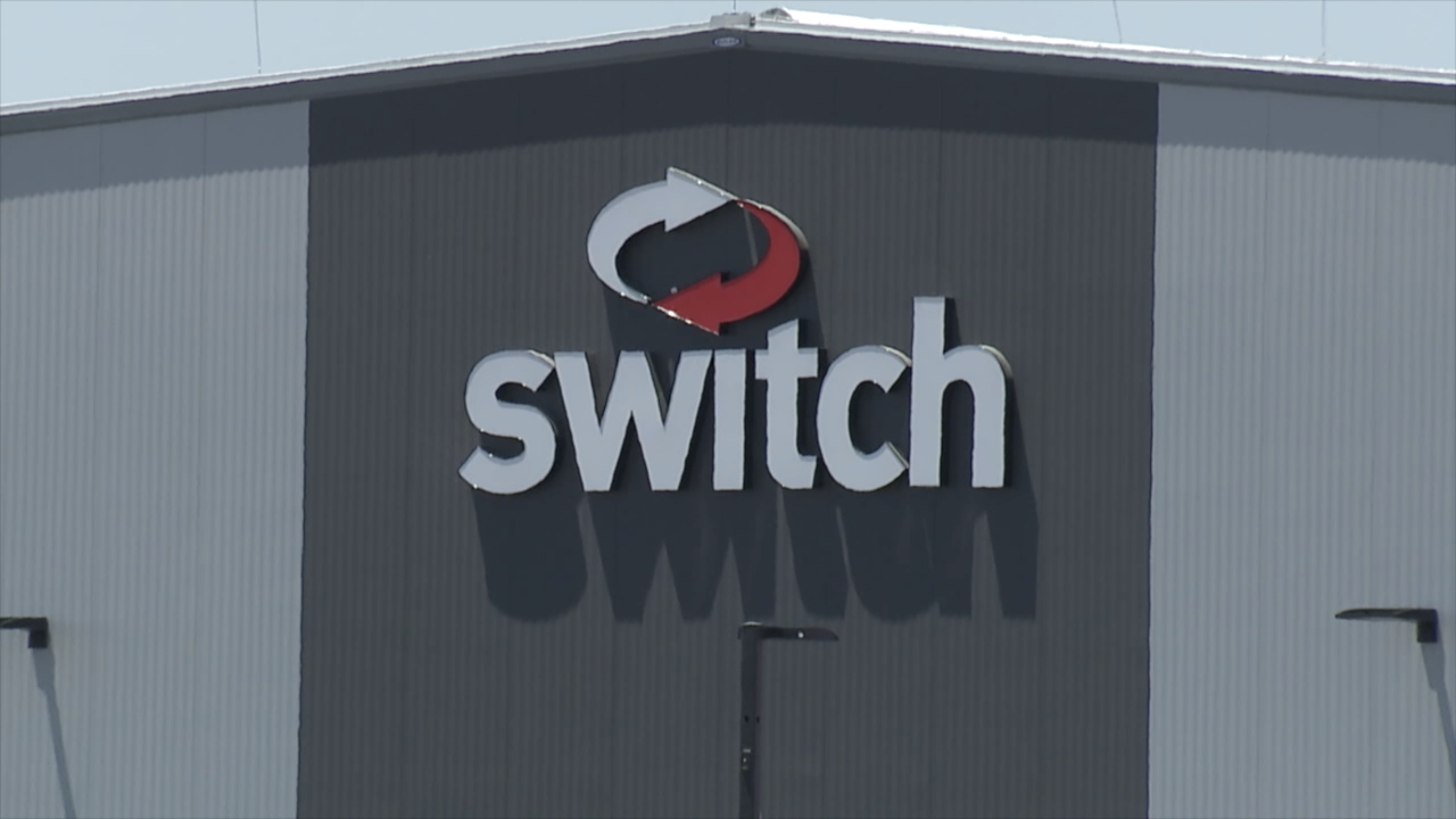 Exterior of a Switch data center building in the Las Vegas Valley, shown in KTNV 13 coverage of the company's growth
