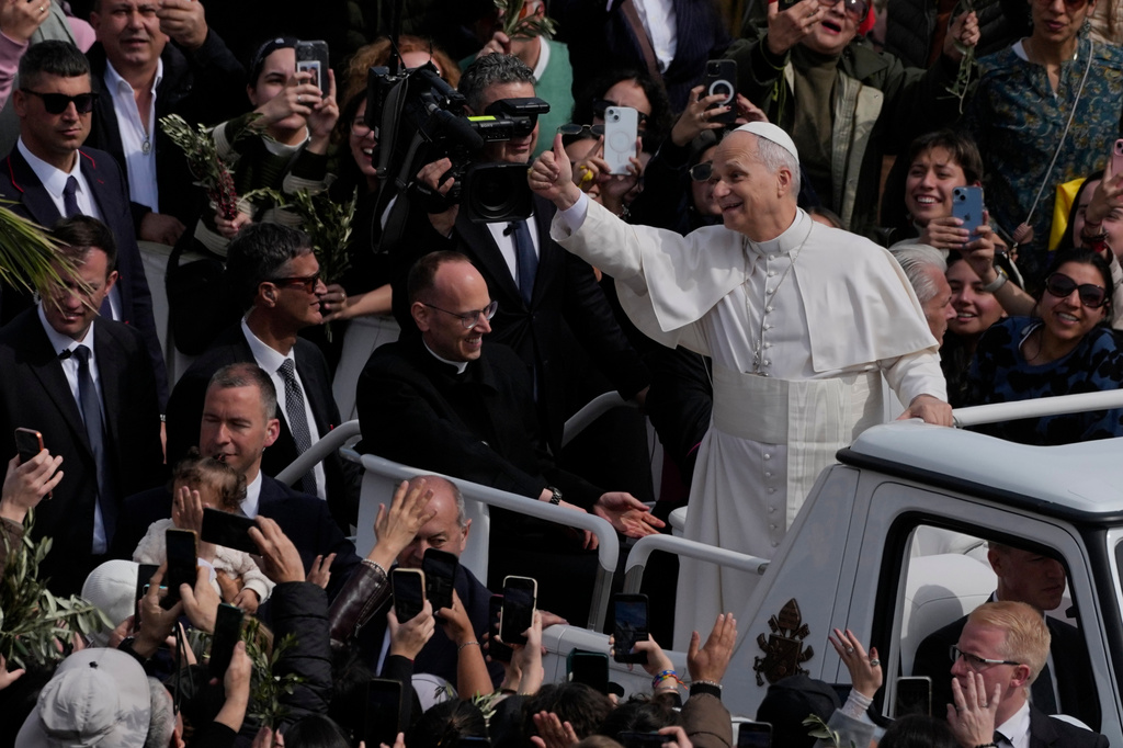 Pope Leo XIV leaves after presiding over Mass in St. Peter's Square at the Vatican on the Catholic feast of Palm Sunday, commemorating Jesus' arrival in Jerusalem, Sunday, March 29, 2026.
