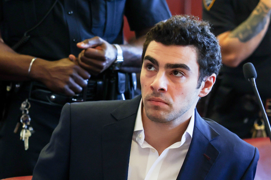 Luigi Mangione appears in Manhattan Criminal Court for an evidence hearing, Dec. 18, 2025, in New York. 