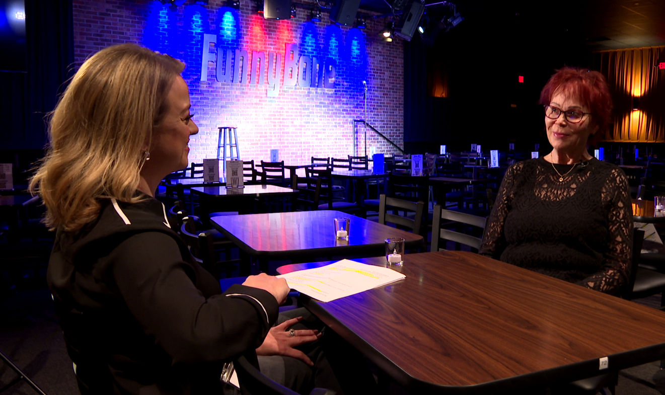 Colleen Quinn speaks to Mary Nelson inside the new Funny Bone showroom at Miracle Hills near 114th and Dodge.