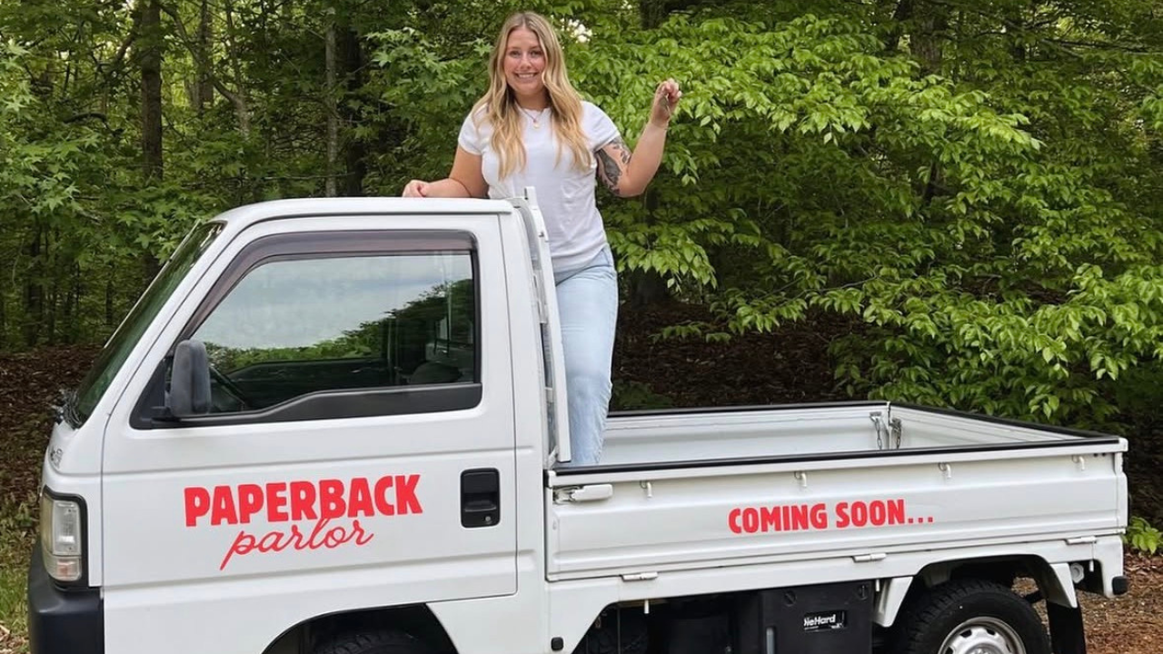 Danielle Tawney with her Honda truck she’ll be using for Paperback Parlor.